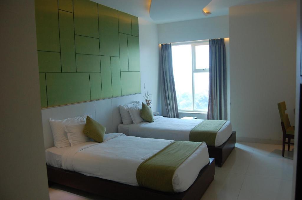 Rose Valley Orbit Hotel Siliguri Rum bild
